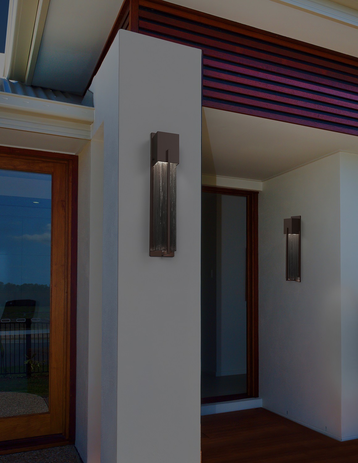 Hammerton Studio Square outdoor wall sconces enhance the pillars of a home exterior