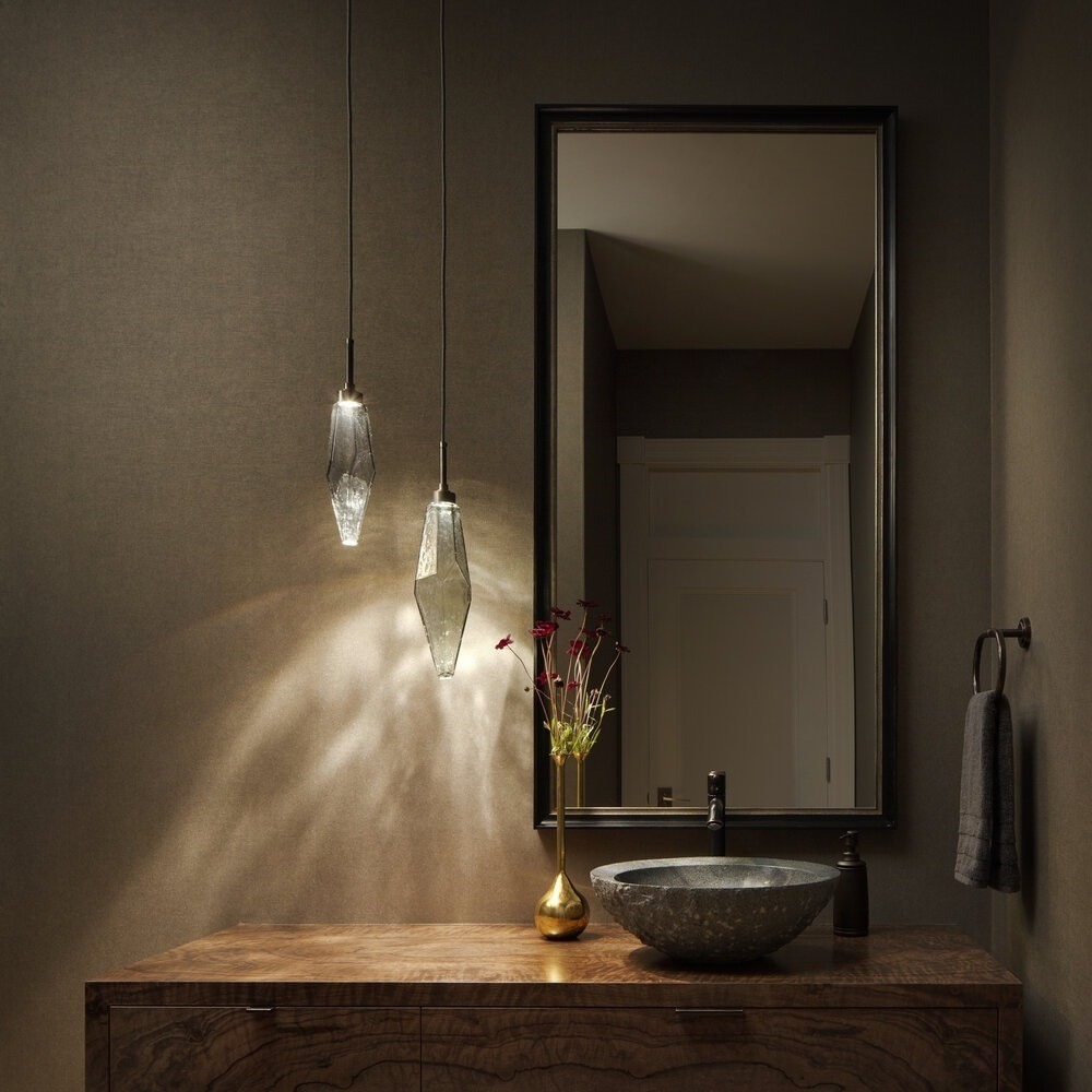 Detail of a Hammerton Studio Rock Crystal pendant light enhancing a beautiful bathroom