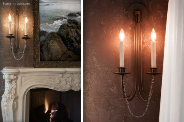  This sleek, old world-inspired candle light sconce features soft clean lines echoed in a graceful strand of crystal beads. 