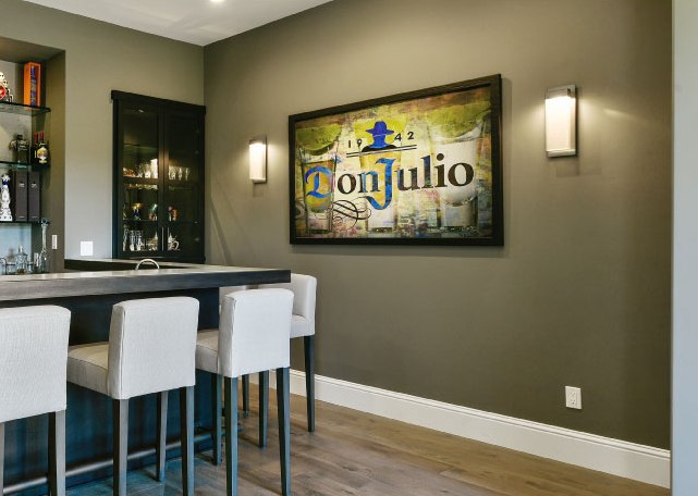 An LMK client opted to switch out a dining area for this festive Tequila bar. On the wall: Parallel LED sconces.