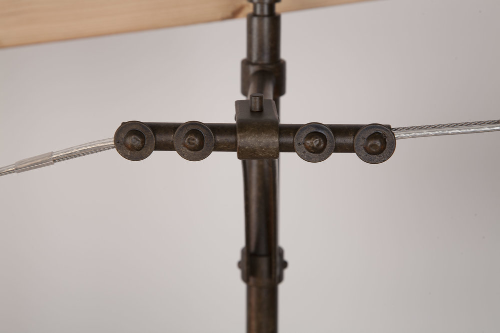 It’s all in the details: If you’ve ever sat on a chair lift, you’ll recognize this cable suspension design. This version, however, is barely an inch in height!