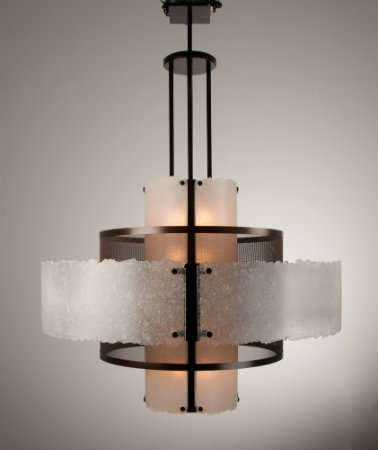 A three layer drum chandelier featuring glass and mesh. 