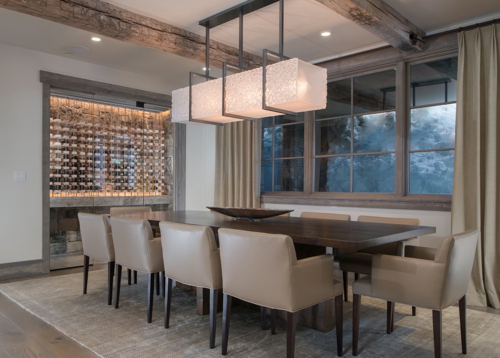 A glistening custom Hammerton dining light in artisan fused glass hangs in the dining room of this contemporary mountain home by &nbsp; KAM Designs . See this entire project &nbsp;in our Shooting Star residential case study &gt;