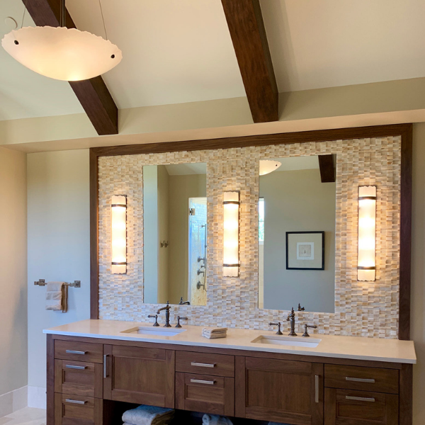 Kiln-fused crystal fixtures from the Hammerton Heritage Fusion collection add visual interest to this mountain chalet bath. Interiors: PC Designs LLC l Denver CO
