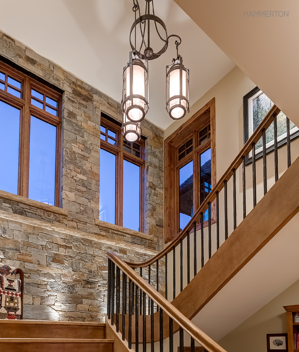  A Chateau pendant chandelier brings European flair to this old-world staircase. 