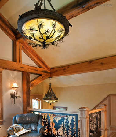  Two pine bough-laden Log &amp; Timber dome lights nod to this stairwell's nature-inspired silhouette. 
