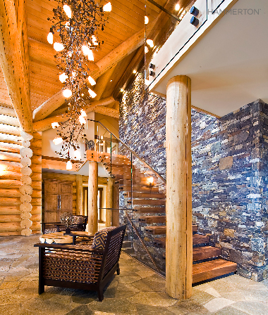  A cascading fixture of glittering aspen branches, sculpted in steel, provide an eye-catching focal point in this Canadian retreat. Interiors by Sticks &amp; Stones Design Group. 