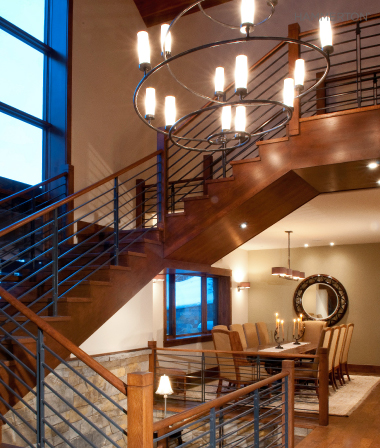  Clean lines in this Seriph chandelier quietly complement the spare railing of a contemporary staircase. 
