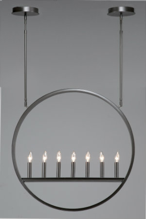  This fixture's unique circular shape and sleek metal candles are defined by a distinctly modern aesthetic. 