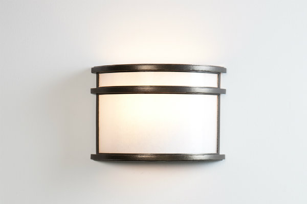  With its striking simplicity, this cover sconce can be placed on either side of a headboard to add an elegant allure to contemporary bedrooms. 