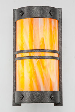  Swirling colors of slumped art glass and a stippled antique iron finish form an eclectic cover sconce that can make a bold statement in any transitional space. 