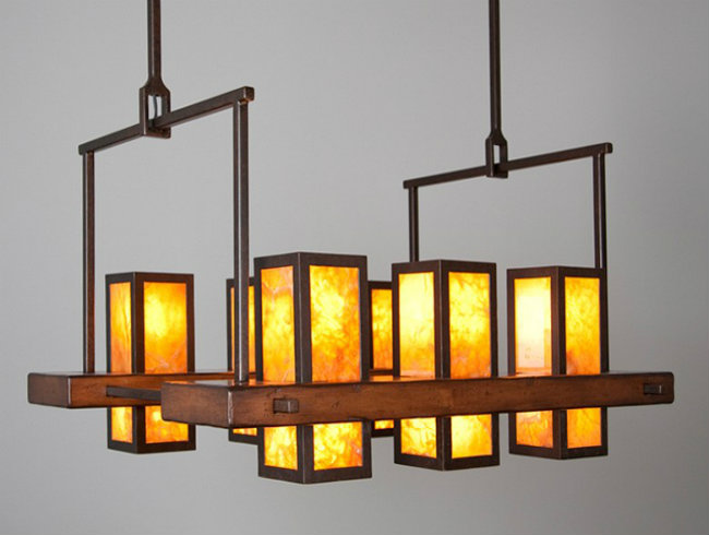 This custom chandelier features hand-hewn panels of honey onyx stone