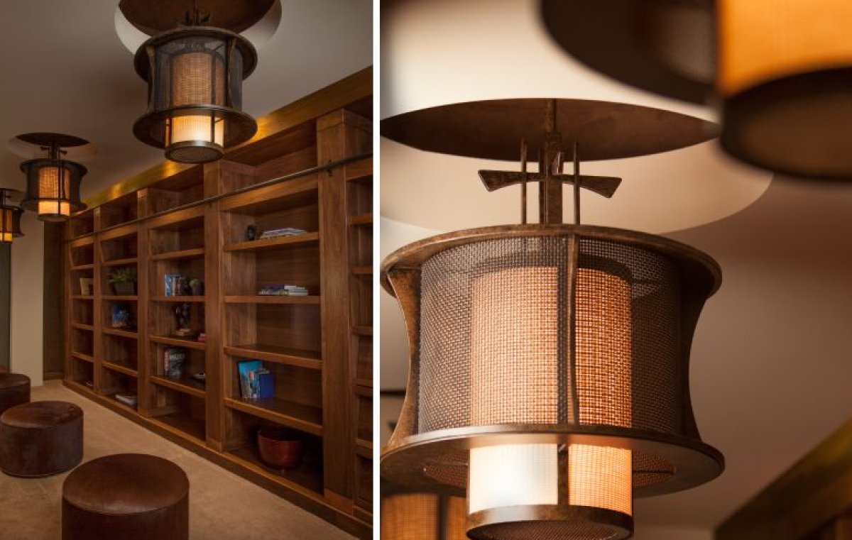  For the library of this sleek Las Vegas residence, we designed a trio of custom ceiling pendants by layering woven steel mesh over Tiko ecoresin and bronze finished cylinders. The mesh further enhances the fixture's glow for a striking diffusion of light. 
