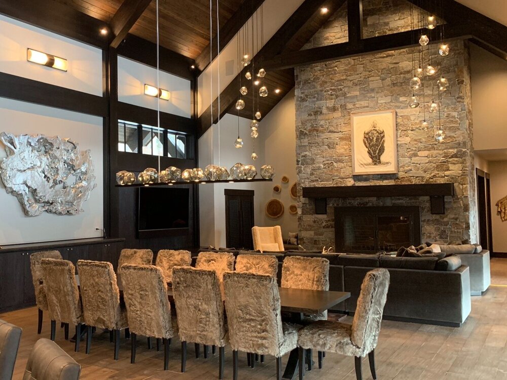 A Hammerton Studio custom Gem linear suspension ads a touch of glamour in this cozy dining space by Ronda Divers Interiors | Lake Oswego, OR