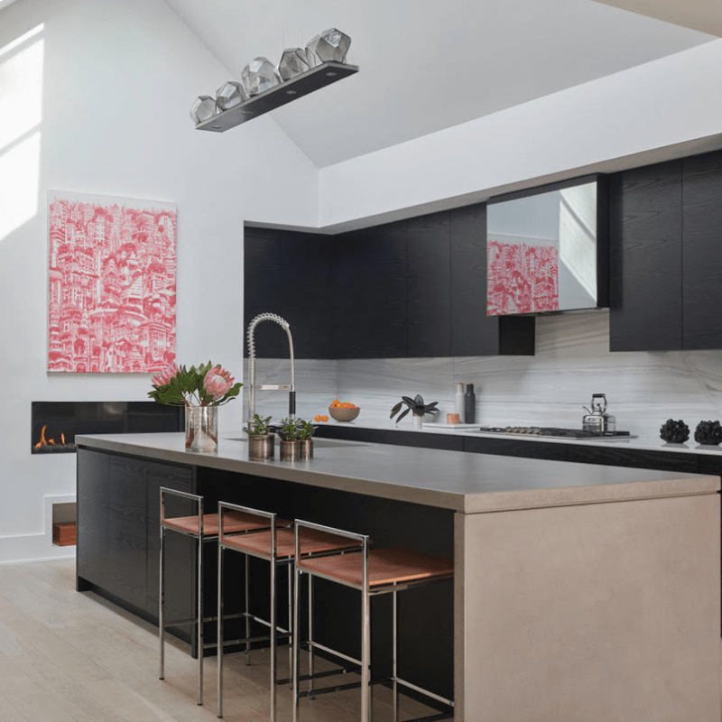 blown glass that looks like natural rocks add the perfect organic touch to this kitchen setting that features otherwise clean lines