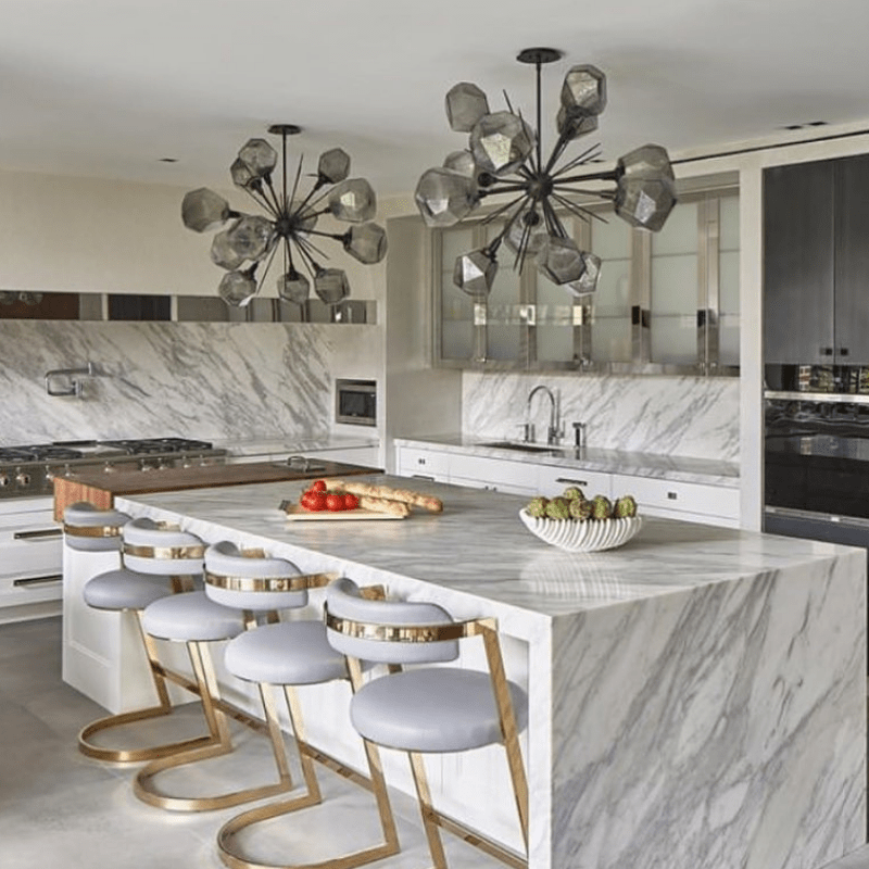 matte black starburst chandeliers make a bold statement in this kitchen