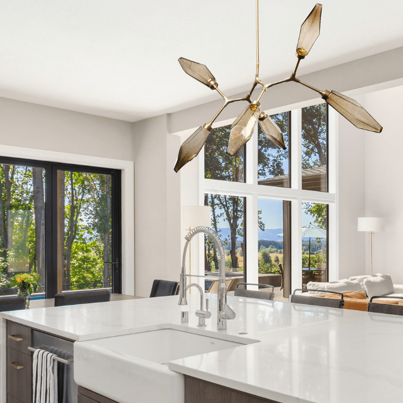 brass and nickel finishes blend nicely in this coastal kitchen setting