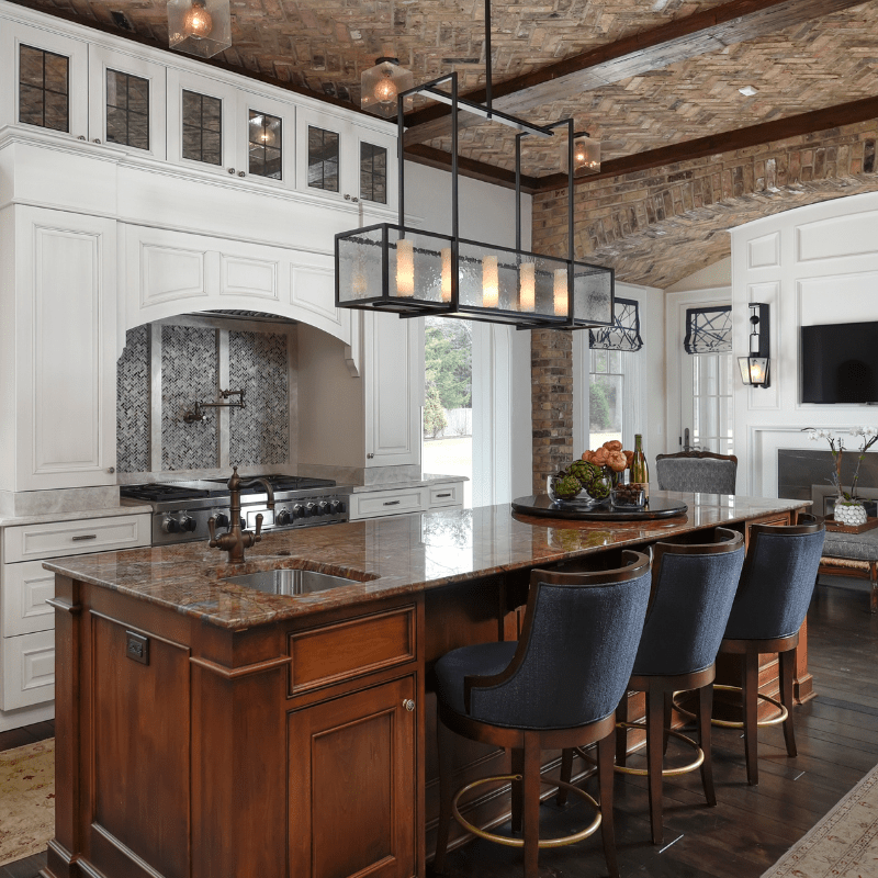 bricks adorn the ceiling of this kitchen in a houndstooth pattern and set an expectation of luxury and elegance that is met by this custom Hammerton Heritage rectangular chandelier